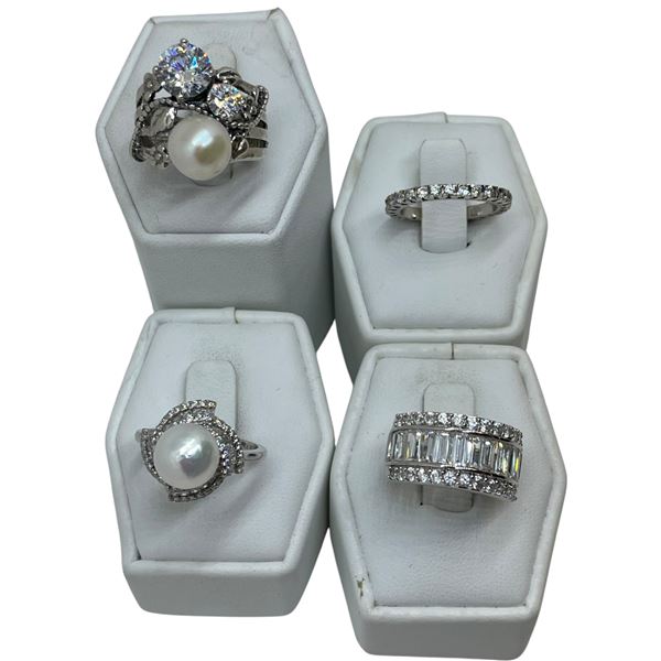 4 Rings Stamped .925 (CZ, Faux Pearl and Crystals) - Widest ring face is 20 mm * Total weight: 22 gr