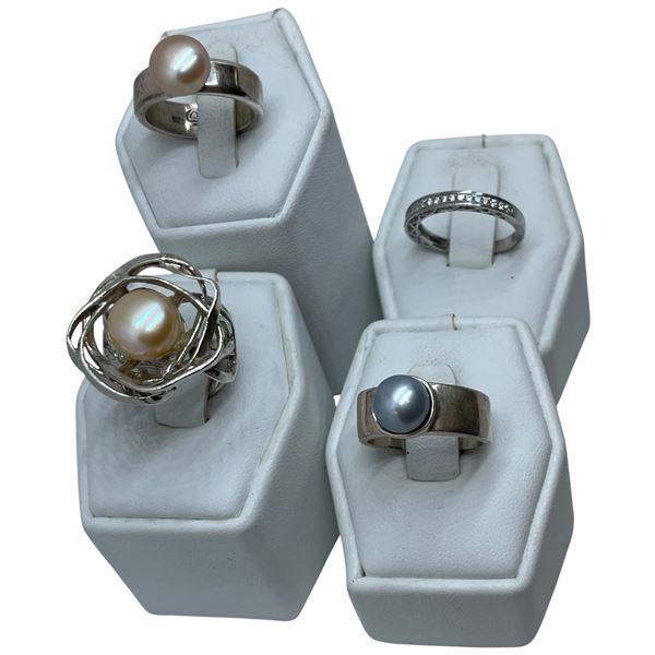 4 Rings Stamped .925 (3 Pearl & 1 Crystal band) Widest ring face is 22 mm * Total weight: 26 grams