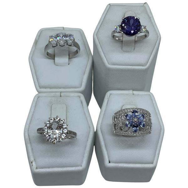 4 Amethyst, Sapphire & Crystal Rings Stamped .925 - Widest ring face is 14 mm * Total weight: 16 gra