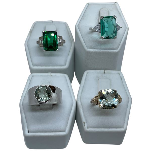4 Peridot, Emerald, & Clear Crystal Rings Stamped .925 - Widest ring face is 14 mm * Total weight: 2