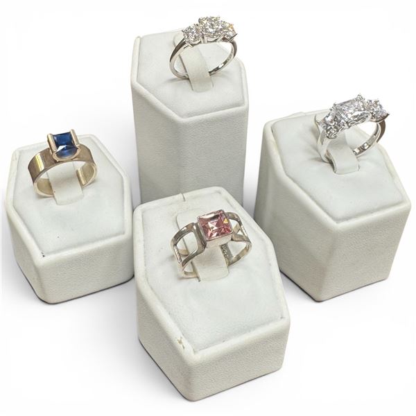 4 Rings Stamped .925 (CZ, Pink, Blue and Clear Crystals) Widest ring face is 9 mm * Total weight: 15