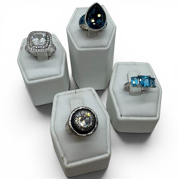 4 Blue Topaz Crystal Rings Stamped .925 - Widest ring face is 19 mm * Total weight: 21 grams