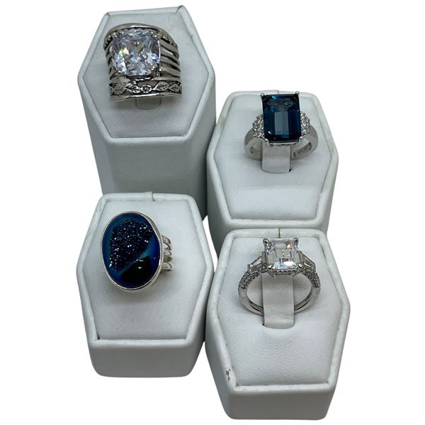 4 New Rings Stamped .925 (Clear and Sapphire Crystal) longest ring face is 20 mm * Total weight: 25