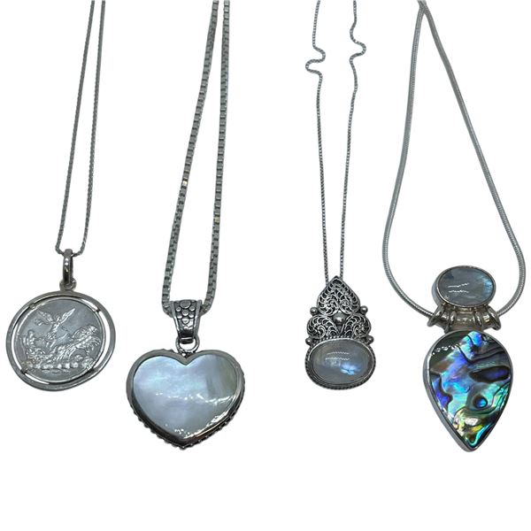 4 Sterling Silver Pendant Necklaces (Heart necklace is reversible) Total weight: 57 grams