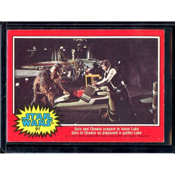 1977 O-Pee-Chee Star Wars #91 Solo and Chewie prepare to leave Luke