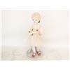 Image 1 : PORCELAIN HEIDI STATUE HOLDING A BOUQUET OF FLOWER