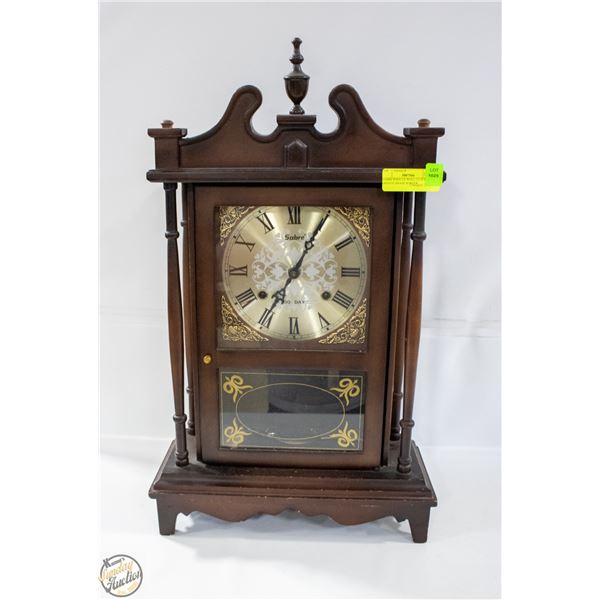 SABRE WIND UP WALL CLOCK WITH ORNATE BRASS BORDER