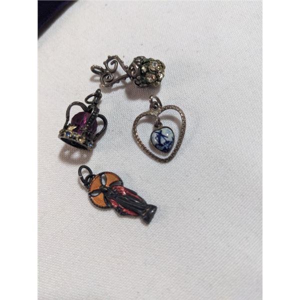 4 ANTIQUE PENDANTS OR CHARMS