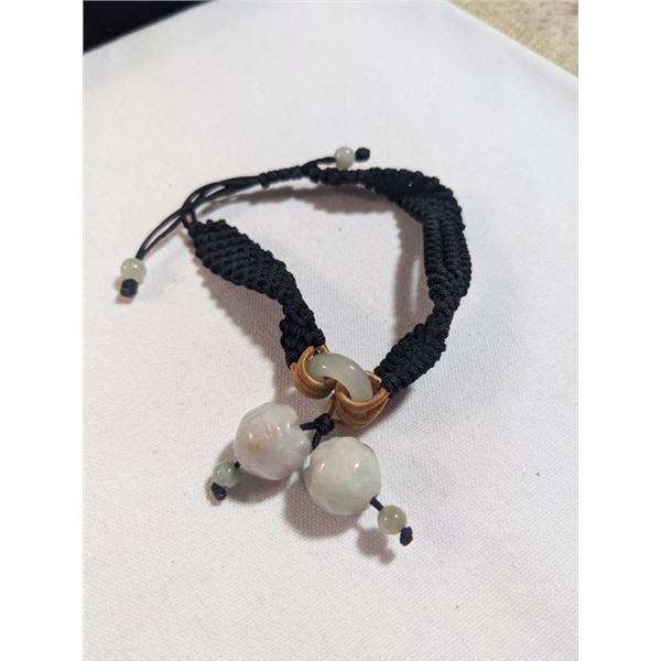 VINTAGE HAND CARVED CHINESE JADE W/ BLACK CORD BRACELET