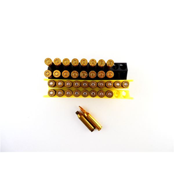 REMINGTON .243 WIN AMMO AND ASSORTED .243 WIN PRIMED BRASS CASES LOT