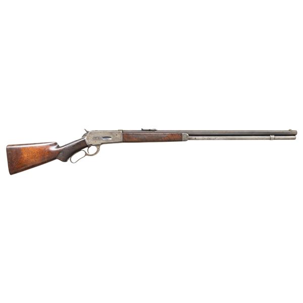 ANTIQUE WINCHESTER 1886 DELUXE LEVER ACTION RIFLE.