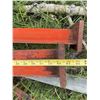 Image 1 :  Steel feed stand  I-beams with orange paint, each beam measuring approximately 7 inches in width an