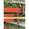 Image 2 :  Steel feed stand  I-beams with orange paint, each beam measuring approximately 7 inches in width an