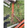 Image 5 :  Steel feed stand  I-beams with orange paint, each beam measuring approximately 7 inches in width an