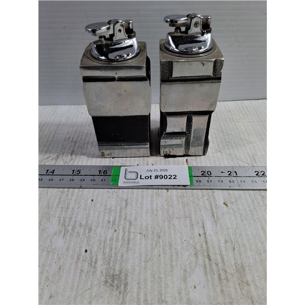Pair of Solid Metal Sculpture Table Lighters signed "Leo". Possibly Leo Mol