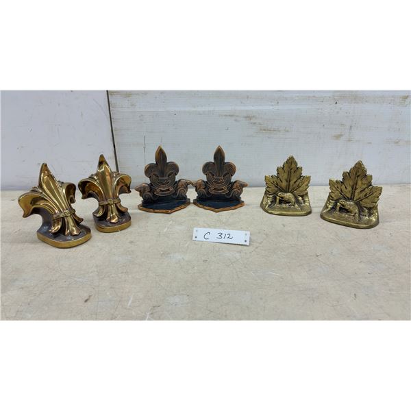 Three Pairs of Vintage Brass Bookends: Fleur-De-Lis, Boy Scout, and Maple Leaf with Kiwi