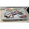 Image 6 : AFX Speed Steer Maniac Madness Slotless Racing System and Stop Police Radar Chase Race Sets