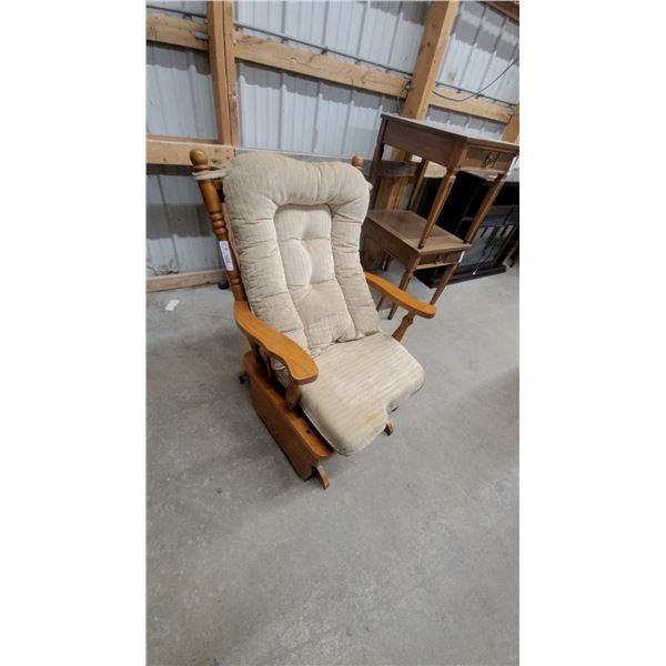 Wooden Glider Rocking Chair with Tufted Beige Cushion and Turned Wood Accents