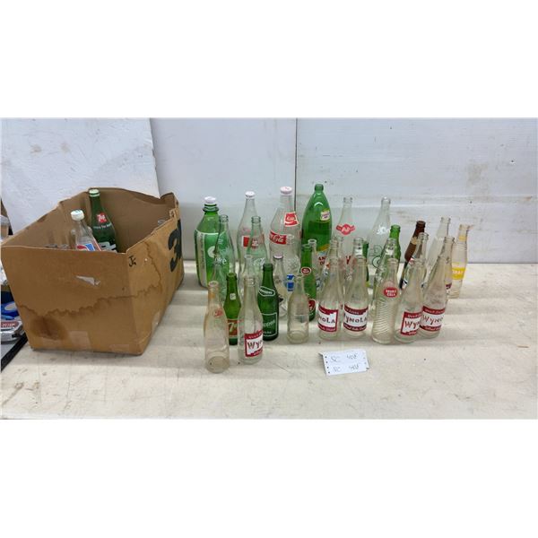 Collection of Vintage Glass Soda Bottles: Coca-Cola, Pepsi, 7UP, Canada Dry, Wynola, and More