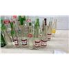 Image 5 : Collection of Vintage Glass Soda Bottles: Coca-Cola, Pepsi, 7UP, Canada Dry, Wynola, and More