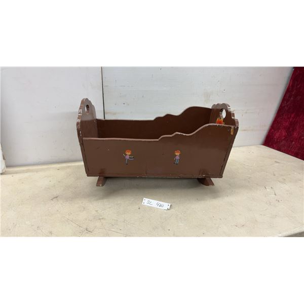Vintage Brown Painted Wooden Doll Cradle with Hand-Painted Child Figures and Rockers