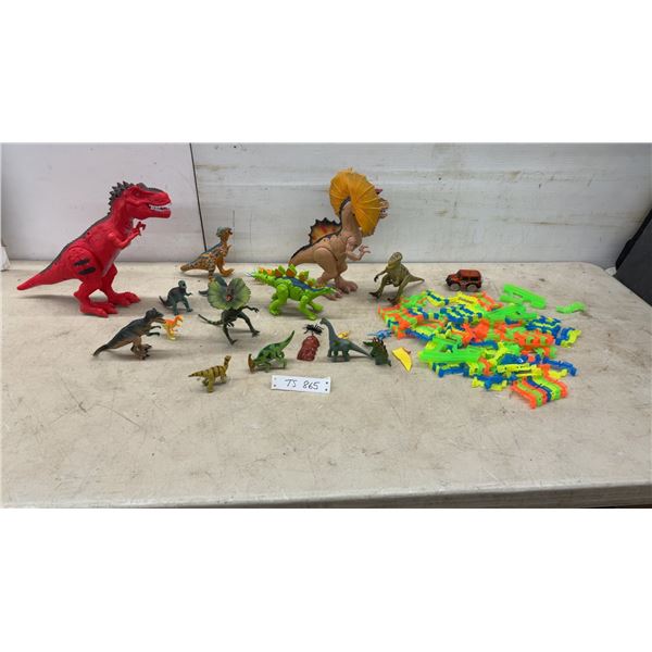 Assorted Plastic Dinosaur Figures, Toy Jeep, and Interlocking Track Pieces