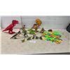 Image 1 : Assorted Plastic Dinosaur Figures, Toy Jeep, and Interlocking Track Pieces