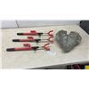 Image 1 : Three Red Steering Wheel Locks with Keys and Decorative Leaf-Shaped Concrete Garden Stone