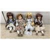 Image 1 : Set of Four Collectible Porcelain Dolls with Lace-Trimmed Dresses and Braided Hair