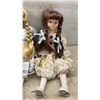 Image 5 : Set of Four Collectible Porcelain Dolls with Lace-Trimmed Dresses and Braided Hair