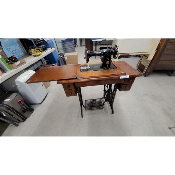 Antique Singer Model 66 "Red Eye" Treadle Sewing Machine in Wooden Cabinet with Cast Iron Base