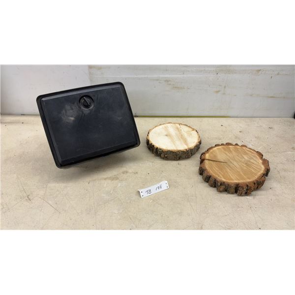 Black Plastic Glove Box & Two Wood Slices