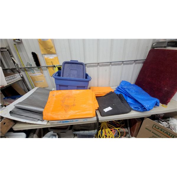 Assortment of Folded Tarps in Blue, Orange, Silver, and Black Wirh Storage Tote