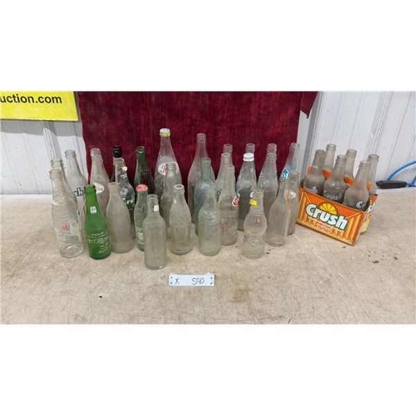 Vintage Glass Soda Bottles Including Pepsi-Cola, 7 up, Crush, Coca-Cola, Elite, and More
