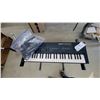 Image 2 : Yamaha PortaSound PSS-450 Electronic Keyboard with X-Style Stand, Cables, and More