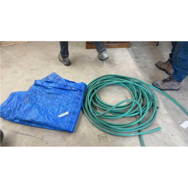 Blue Polyethylene Tarp with Metal Grommets and Green Garden Hose Missing End