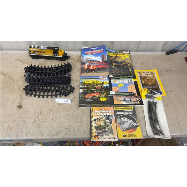 Caterpillar Toy Diesel Locomotive, HO Scale Track, Walthers and Atlas Railroad Books, and More