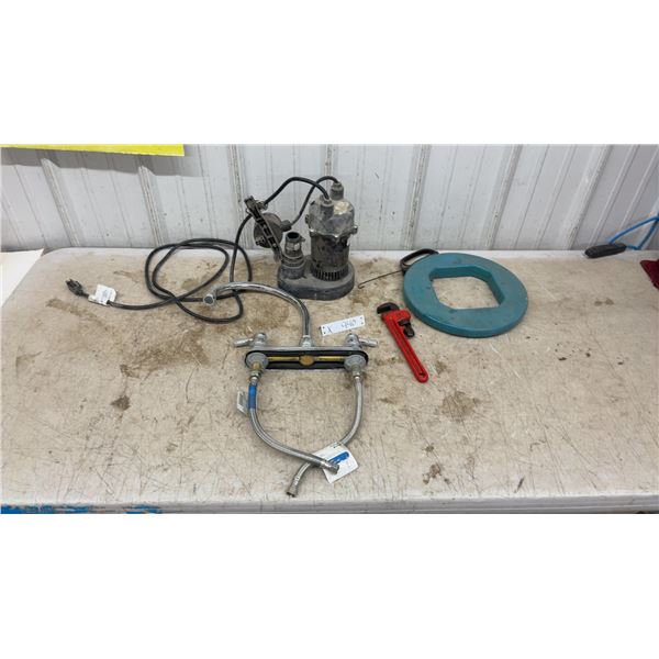 Sump Pump, Chrome Two-Handle Faucet, Ridgid Pipe Wrench, and Ideal Fish Tape Reel