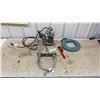 Image 1 : Sump Pump, Chrome Two-Handle Faucet, Ridgid Pipe Wrench, and Ideal Fish Tape Reel