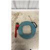 Image 2 : Sump Pump, Chrome Two-Handle Faucet, Ridgid Pipe Wrench, and Ideal Fish Tape Reel