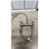 Image 3 : Sump Pump, Chrome Two-Handle Faucet, Ridgid Pipe Wrench, and Ideal Fish Tape Reel