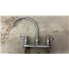 Image 4 : Sump Pump, Chrome Two-Handle Faucet, Ridgid Pipe Wrench, and Ideal Fish Tape Reel
