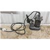 Image 5 : Sump Pump, Chrome Two-Handle Faucet, Ridgid Pipe Wrench, and Ideal Fish Tape Reel