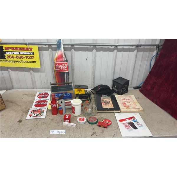 Coca-Cola Collectibles Lot: Bottle-Shaped Tin Sign, Trivets, Price Guide, Mugs, Tins and More