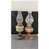 Image 2 : Collection of 7 Oil Lamps: 2 Tall Clear Glass, 1 White Milk Glass, 1 Red, 1 Black, 1 Green