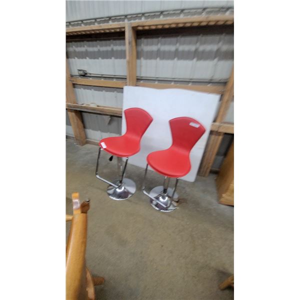 Pair of Modern Adjustable Bar Stools with Red Upholstered Contoured Seats and Chrome Pedestal Bases