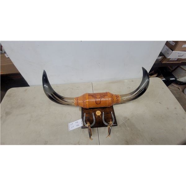 Mounted Steer Horns with Tooled Leather Wrap and Decorative Spurs on Wooden Plaque with Horse Shoe