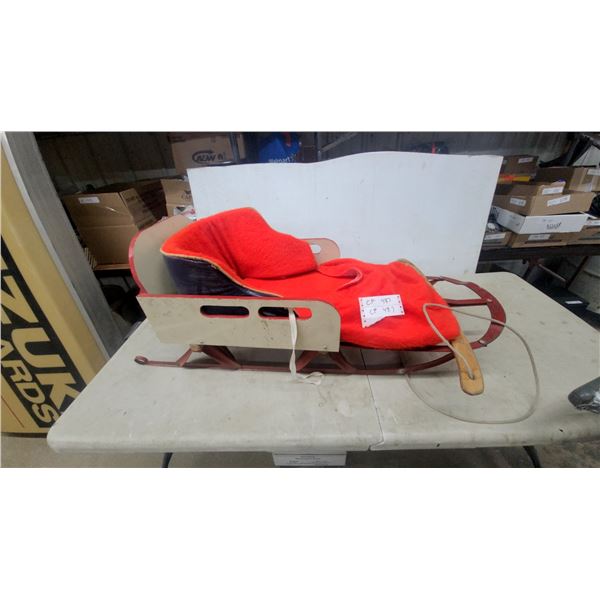 Vintage Wooden Child's Sled with Red Metal Runners and Faux Fur Cushion