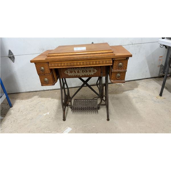 Antique Raymond Treadle Sewing Machine Cabinet With Carved Oak and Cast Iron Base