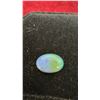 Image 2 : 3 Gemstone Lot: Oval Opal Cabochon, Faceted Red Garnet, and Yellow-Green Gemstone
